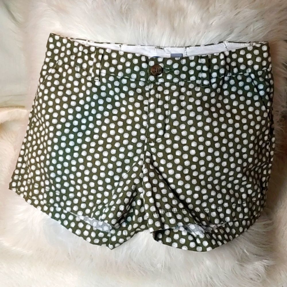 Old navy shorts olive green in color with white sea shells on them.size 4